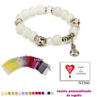 Pulsera de perlas blancas con brillantes de colores y saco de d&oacute;lar
