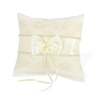 Cojín beige y perlas