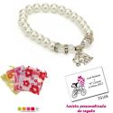 Pulsera de perlas blancas y abalorios con brillantes, y un colgante de elefante