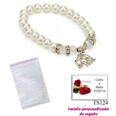 Pulsera de perlas blancas y abalorios con brillantes, y un colgante de elefante