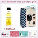 Botellita de Ron Miel con bolsa “charlestón” y tarjeta
